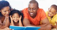 family of four reading together